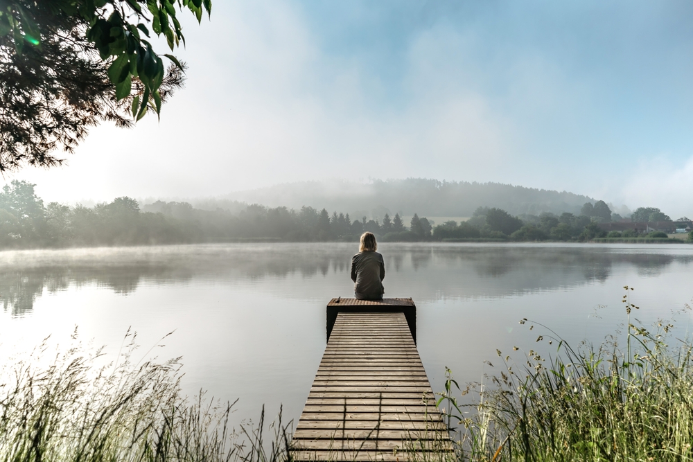 meditation on dock by lake